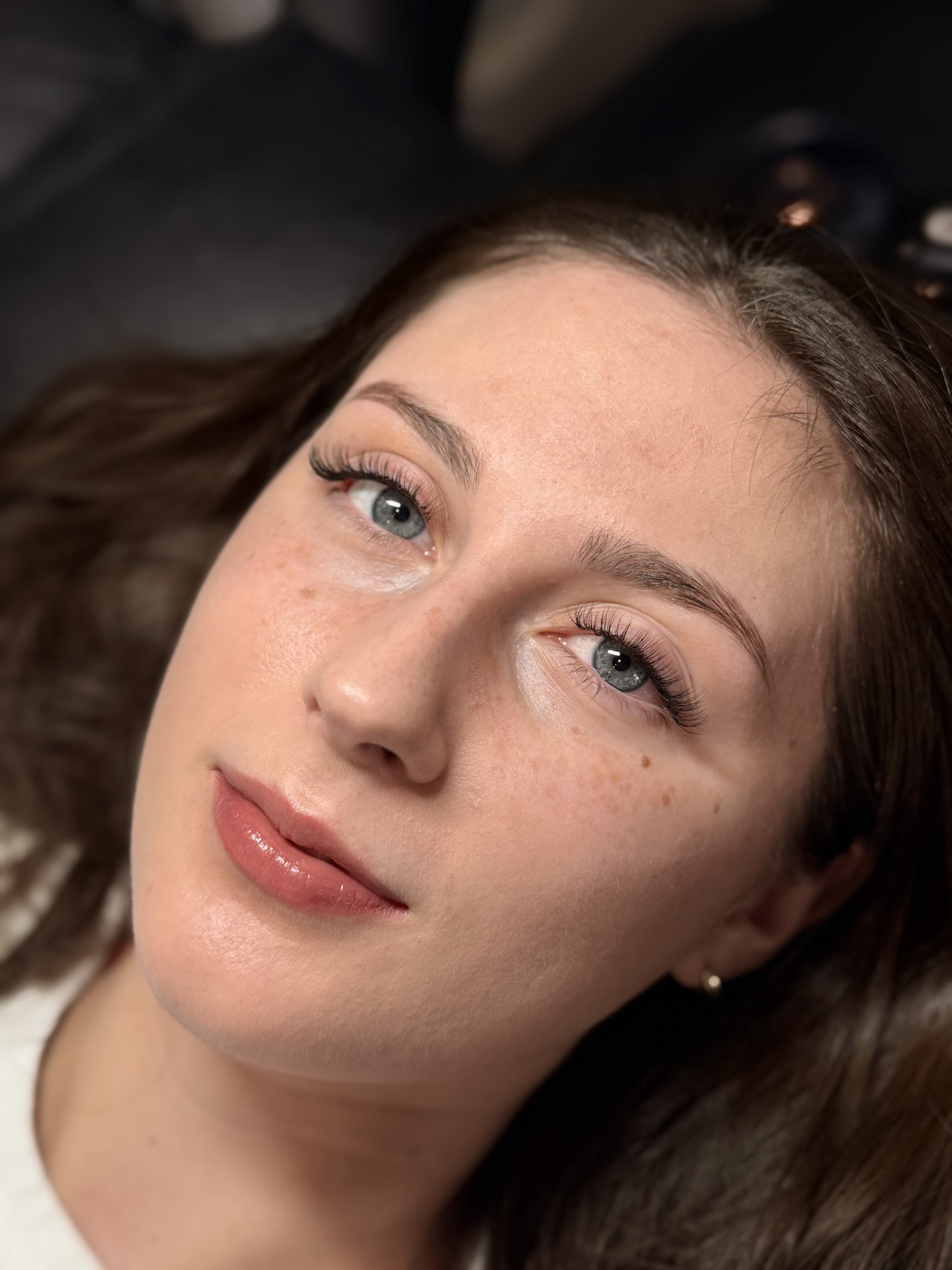 A client with a fresh set of lash extensions